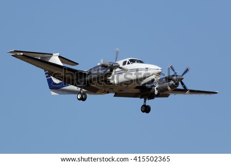 Small turboprop airplane approaching the runway Royalty-Free Stock Photo #415502365