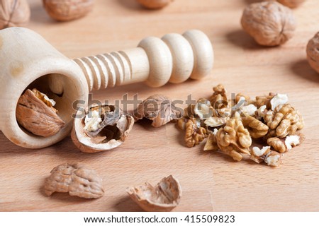 nuts with a broken shell on rustic wooden table