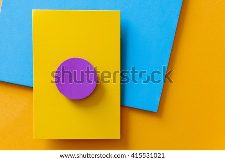 Blue and orange geometric background with a circle that mimics a digital button
