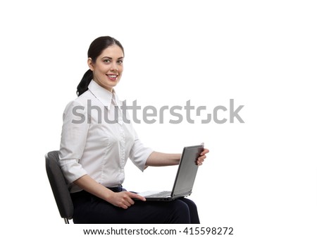 Education, business, technology, people concept - the portrait of smiling young adult woman in white shirt sitting on the office chair with laptop  isolated over white background.
