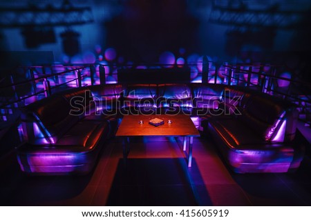 night party vip zone with large leather sofa Royalty-Free Stock Photo #415605919