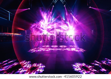 night party rave concert stage with pink lasers Royalty-Free Stock Photo #415605922