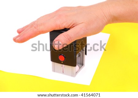 Hand with stamp for documents on white background
