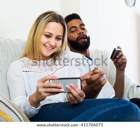 Interracial family having problems becouse of mobile phones addiction indoors