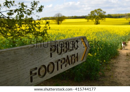 Public footpath sign in the Sussex countryside.