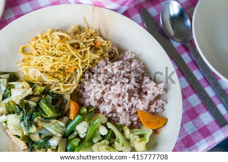 Typical and simple Bhutanese vegetarian meal at restaurant. Royalty-Free Stock Photo #415777708