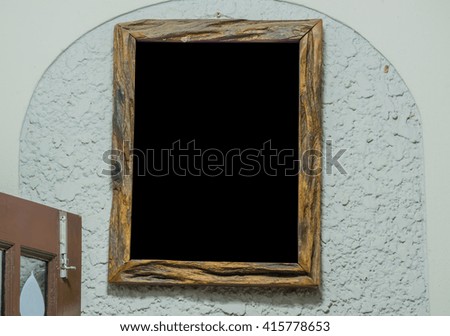 Wood picture frame on the wall.