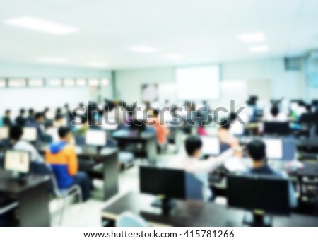 Students studying and testing lesson from teacher in classroom at university. Workshop technology network communication for education,business. Blur background of people using e-learning,training.