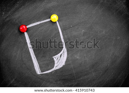  draws a chalk Empty paper sheet  on a black board