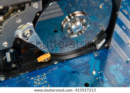 Closeup  inside Hard Drive on motherboard computer hardwar