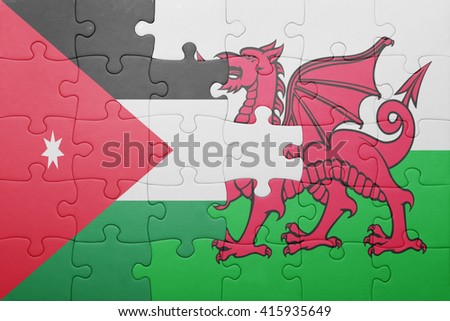 puzzle with the national flag of wales and jordan . concept