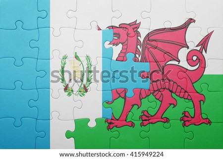puzzle with the national flag of wales and guatemala . concept