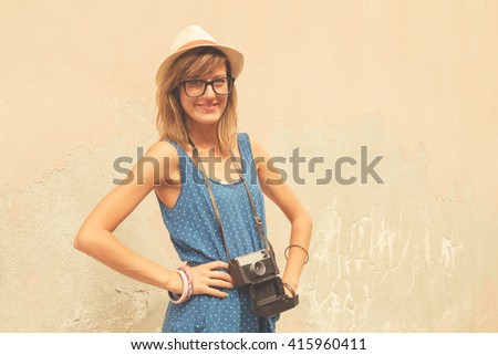 Girl tourist posing on the street.