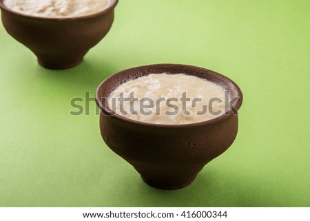 sweet curd or sweet dahi in hindi, served in earthen pot, selective focus