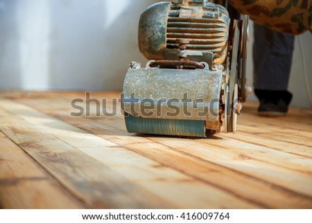 home renovation, parquet sanding, polishing Royalty-Free Stock Photo #416009764