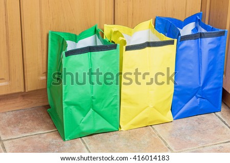 Green, blue and yellow bags are ready to use in sorting household waste