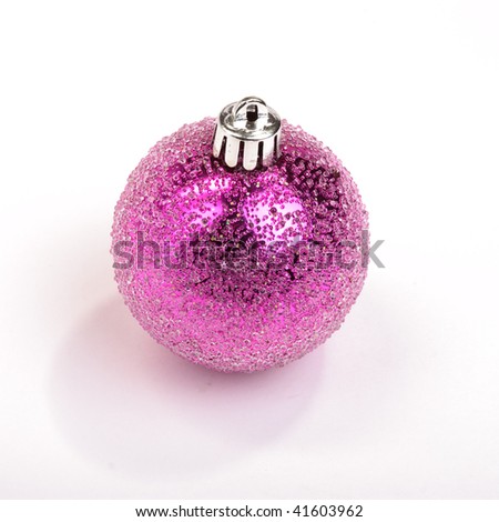 Vibrant pink sparkly christmas tree bauble isolated against white background.