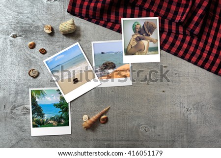 Part of set. Beautiful seaside snapshots arranged on rustic wooden background with seashells and a scarf around, horizontal top view with copy space