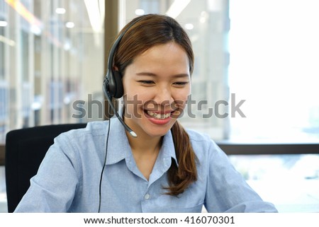 close up call center woman working and talking with customer via ip hone at in office room Royalty-Free Stock Photo #416070301