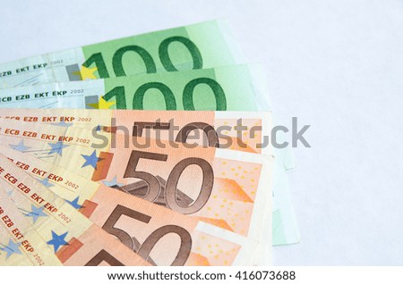 Stack of Euro banknotes isolated white background