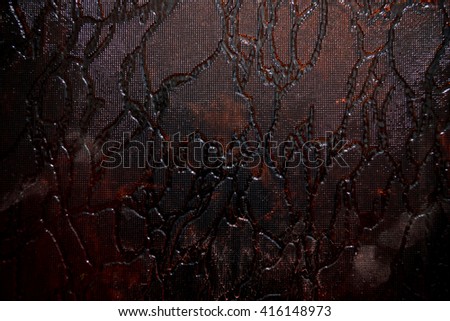 textured surface creates a very interesting pattern. Photo dark color, glass has different color shades.It can be used as the background or texture for any photo editor.