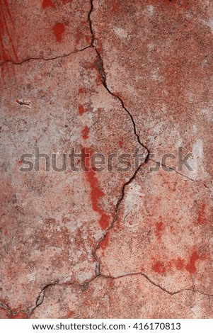 Old wall with cracks and peeling paint. Old lime whitewash. Background. Texture. The wall needs repair. Decorative Facade