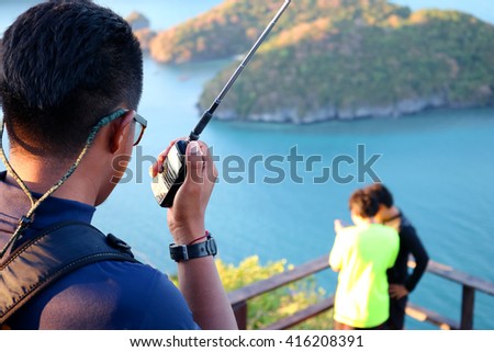 Man use radio on the view point at ang thong island.