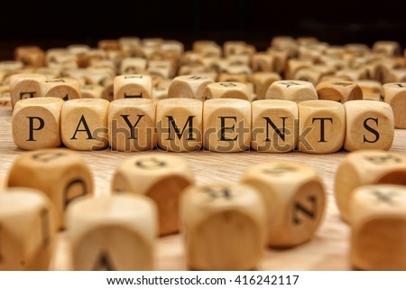Payments word written on wood block