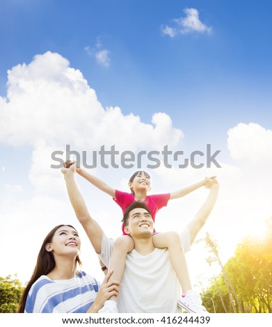 happy asian family with cloud background Royalty-Free Stock Photo #416244439