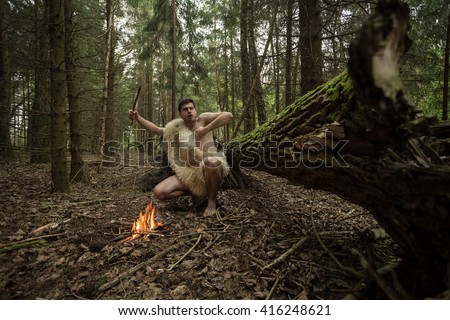 caveman got a fire in the forest, in the skin