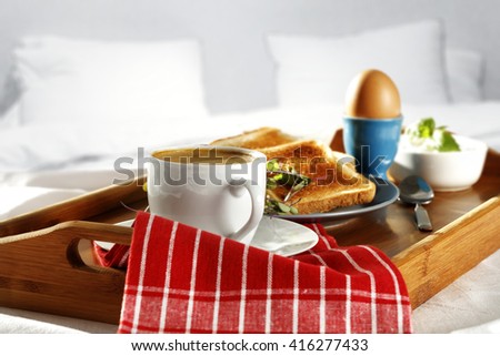 breakfast time in bed and coffee napkin and fresh food 