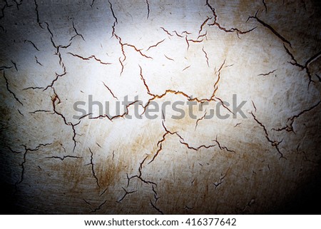 cracked decorative plaster background. old wall texture with golden paint in crack. Cranny vintage screensaver background. Website backdrop. Ancient fresco close-up picture. Home makeover design