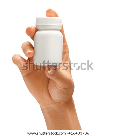 Woman's hand holding bottle for pills isolated on white background. Close up. High resolution product.