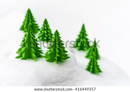 Miniature Winter landscape with fir trees in the snow; Paper Christmas trees in the snow; Christmas greetings; Winter period