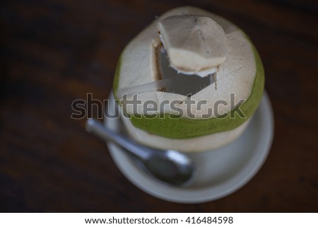 Coconut ready to serve in dark background with toned dark color and selective focus