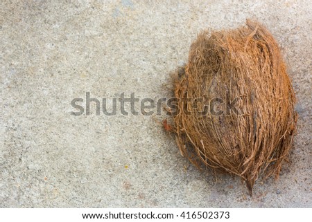 A coconut on concrete background. Produce to transform heathy fruit for production. Beside the beach. Copy space