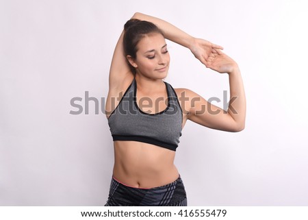 Athlete young woman doing exercise. Isolated white background.