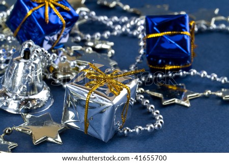Christmas gift boxes, silver stars and bell
