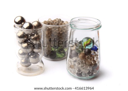 small glass and metal spheres isolated on the white background