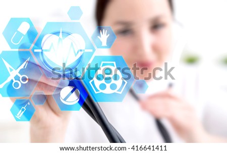 Female doctor using stethoscope on polygonal frames with medicine related icons