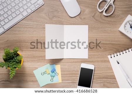 Fathers day composition. Top view of office table with keyboard, note, pen and coffee with blank card open on wooden desk background