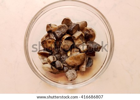 Frozen mushrooms in a glass bowl