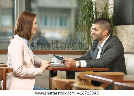 Meeting of man and woman in coffee shop