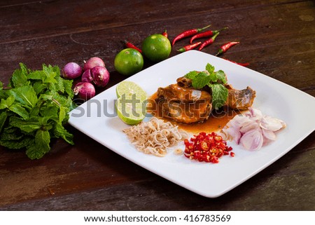 Spicy fish Canned Sardines Salad on wood background