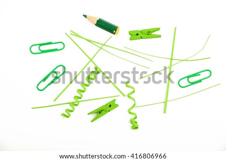 Small things matter, mixed colorful green paper pieces and wooden painted clothespins isolated on white background