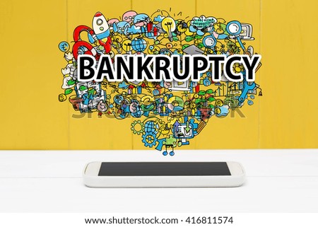 Bankruptcy concept with smartphone on yellow wooden background