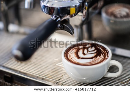 latte art on espresso machine Royalty-Free Stock Photo #416817712