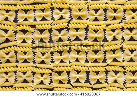 Raw pasta background close up