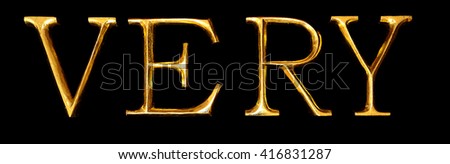 Wooden letters in gold on black background spelling VERY