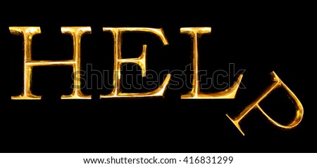 Wooden letters in gold on black background spelling HELP